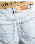 Men's Light Blue Distressed Knee-Length Denim Shorts